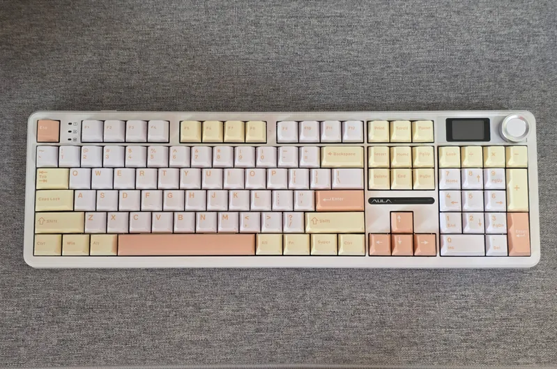 Aula F108 Pro - top view of the full-size keyboard in cream and floral tones with a screen and knob